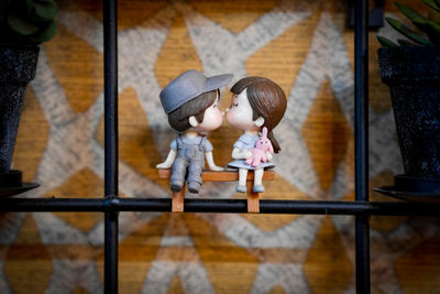 Girl looking at toy while standing on floor