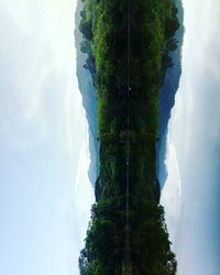 Scenic view of tree mountains against sky