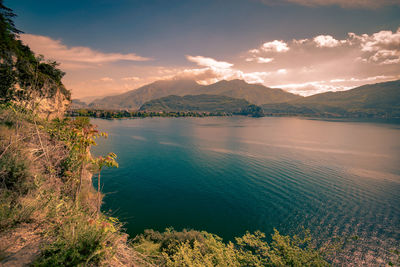 Scenic view of lake against sky during sunset