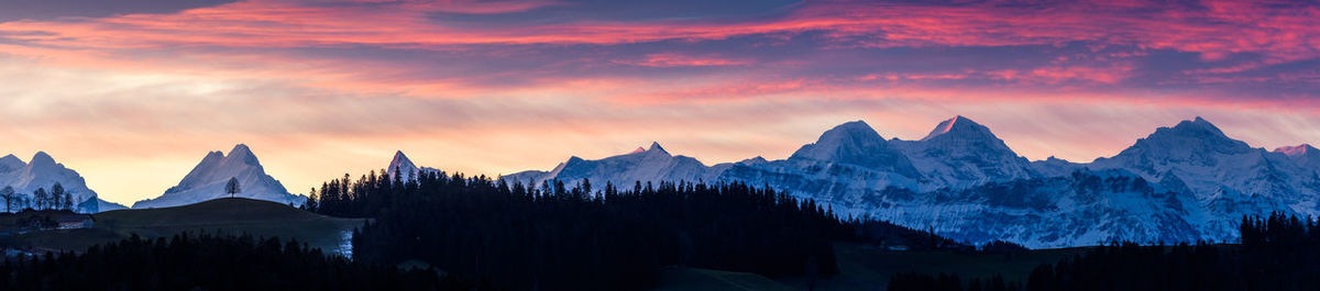 Panoramic shot of silhouette mountains against sky during sunset