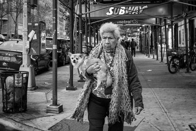 Man with dog in city