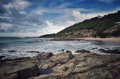 Scenic view of sea against cloudy sky