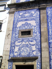 Low angle view of window on old building