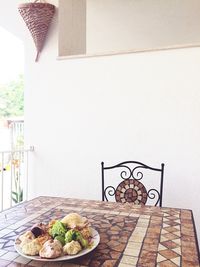 View of food on table against wall at home