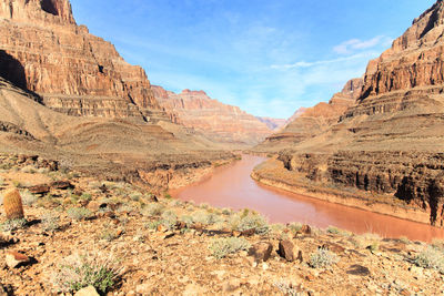 Scenic view of valley through mountains