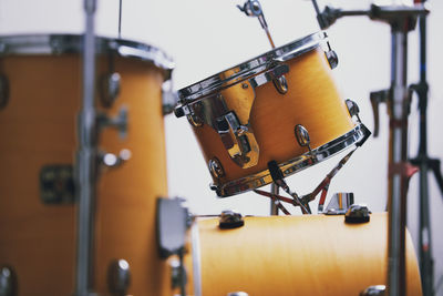 Midsection of man playing drum