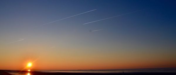 Scenic view of sea against clear sky during sunset