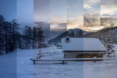 Built structure on snow covered landscape against sky