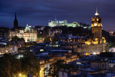 Illuminated buildings in city at night