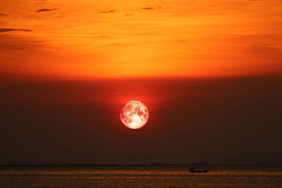 Scenic view of sea against romantic sky at sunset