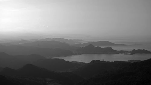 Scenic view of silhouette mountains against sky