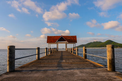 Pier over sea against sky