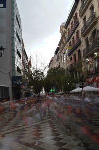 City street amidst buildings against sky