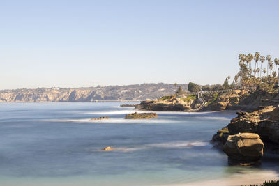 Scenic view of river against clear sky