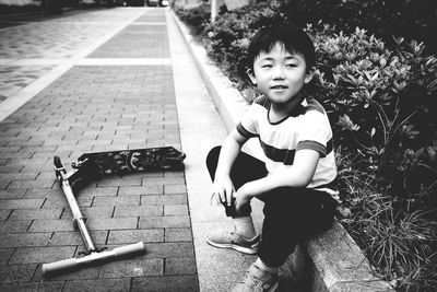 Portrait of boy on ledge