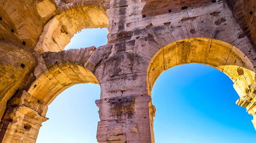 Low angle view of old ruins against clear sky