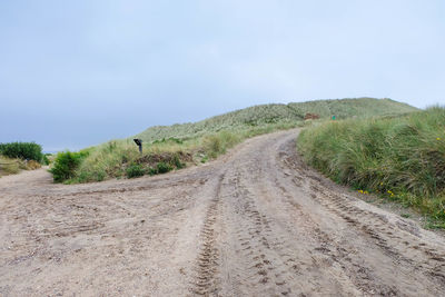 Empty country road along landscape