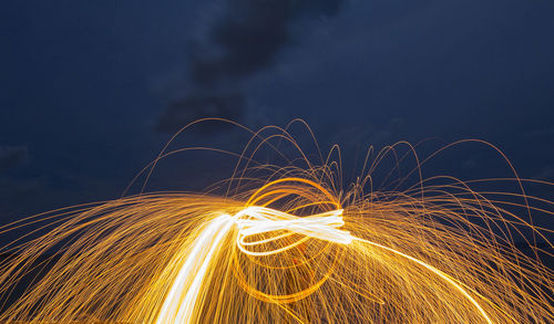 Light trails against sky at night