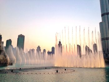 Panoramic view of city buildings against clear sky