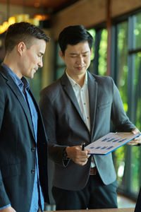 Young couple standing with text