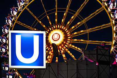 Low angle view of illuminated ferris wheel