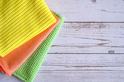 High angle view of multi colored umbrella on wooden table