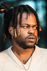 Portrait of young man looking away