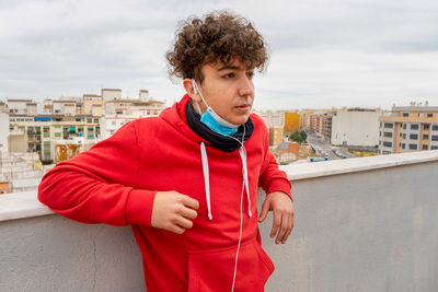 Portrait of young man standing outdoors