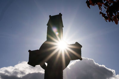 Low angle view of sun against sky