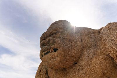 Low angle view of sculpture against sky
