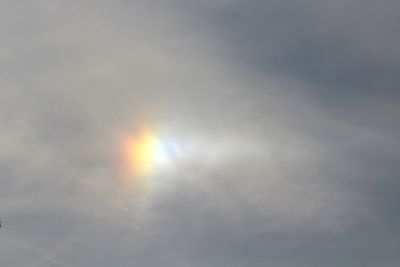 Low angle view of sun shining in sky