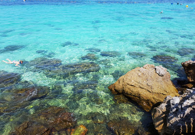 High angle view of rocks in sea