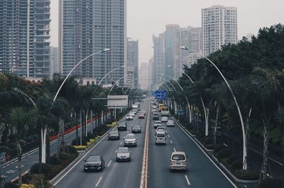 High angle view of traffic on road amidst buildings