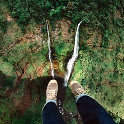 Low section of person standing on land