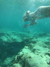 Woman swimming in sea