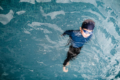 High angle view of man swimming in pool