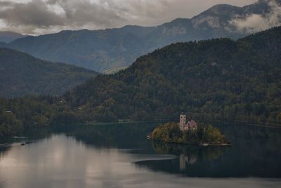 Scenic view of lake and mountains against sky