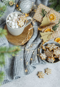 Hot chocolate with marshmallows, warm cozy christmas drink, gingerbread cookies and decorations