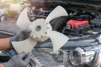 Close-up of man working at machine