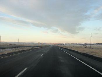 Highway against sky during sunset