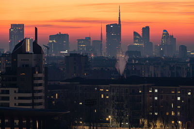 Illuminated buildings in city at night