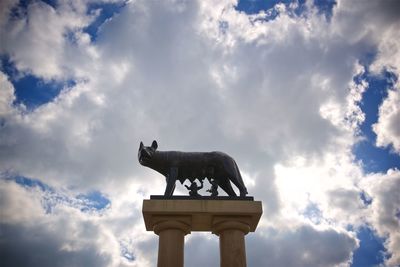 Low angle view of statue against sky