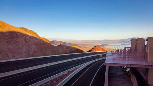 Scenic view of mountains against clear blue sky