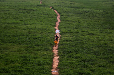 Children running on footpath