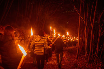  torchlight procession awaiting christmas in the mountains of val serina