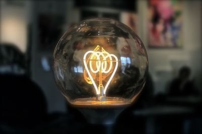 Close-up of illuminated light bulb