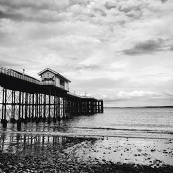 Pier over sea against sky