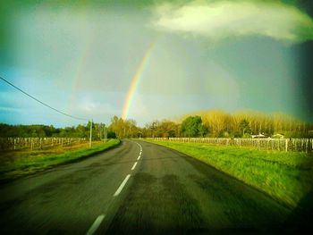 Road passing through field