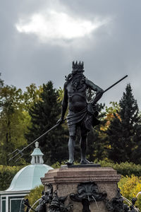 Low angle view of statue against sky