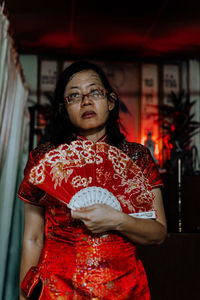 Portrait of mid adult woman standing outdoors